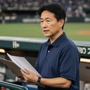 試合会場のベンチ周辺で運営計画を確認する孔道彦さん